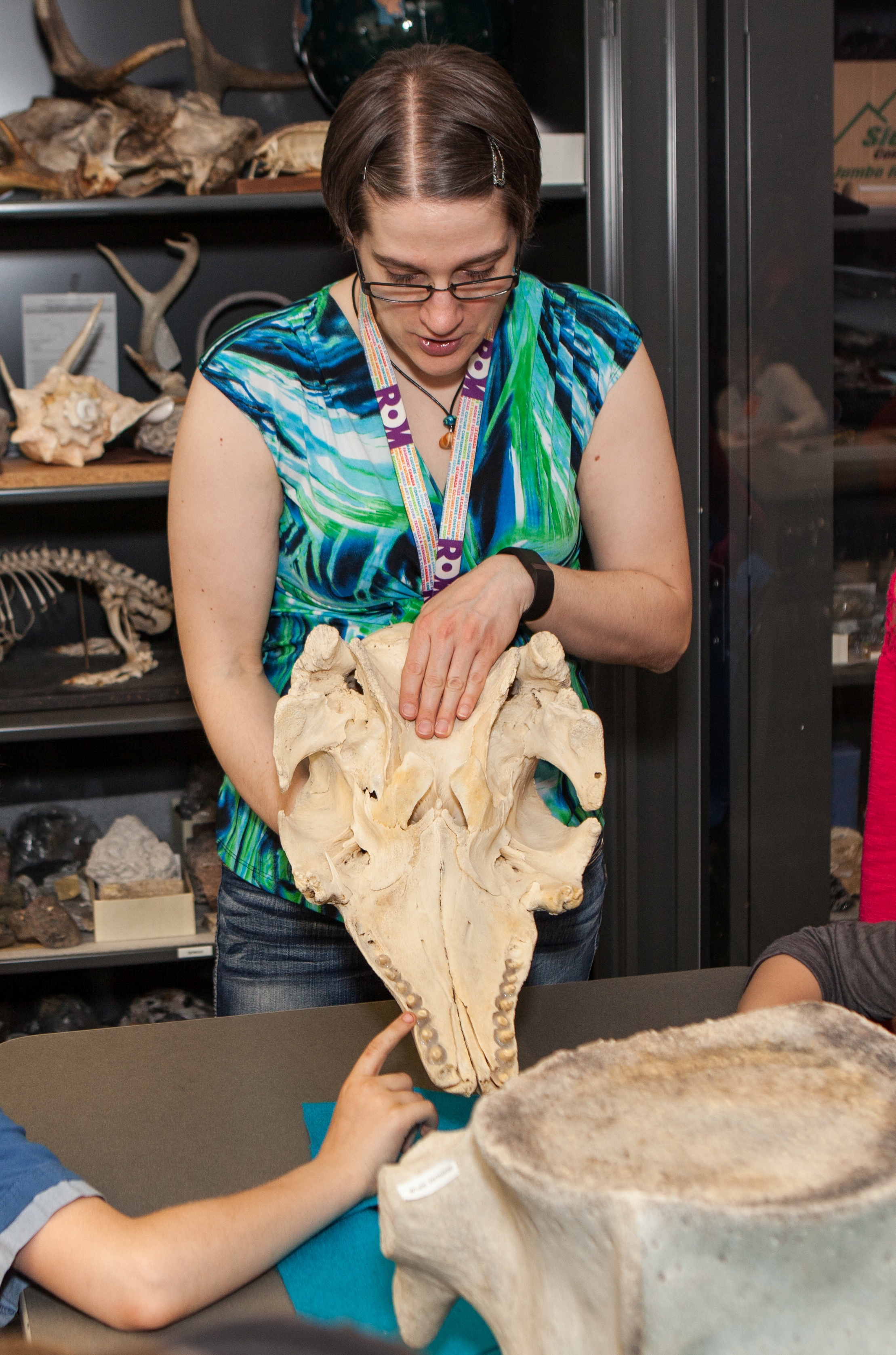 Julie M Tome, YorkU Astronomy Alumna with a dinosaur skull
