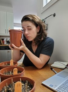 Jenna studying grasses in her kitchen 2020