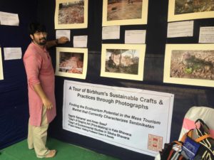 MSc student, Aman Bass at the sustainability photo exhibition booth at the 2018 Ecotourism conference, Visva Bharati University, West Bengal